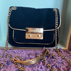 A cute suede Michael Kors crossbody purse